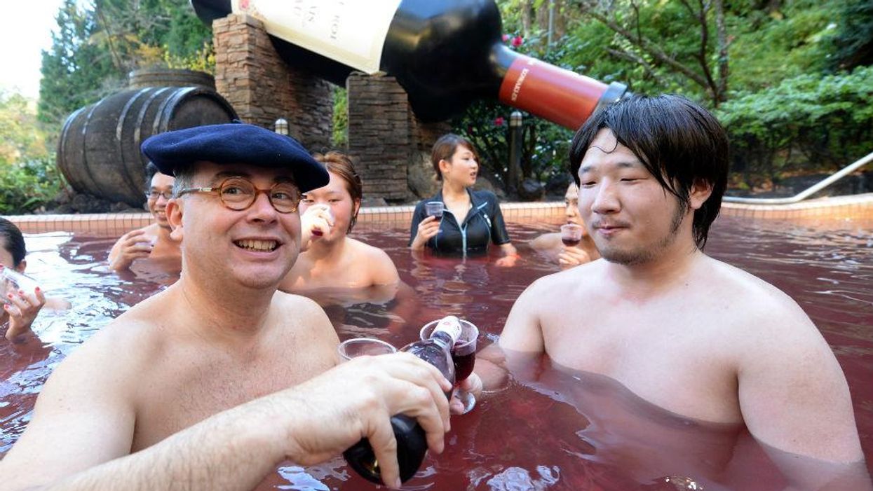 Wine maker Thibault Garin with a guest at the Hakone Yunessun spa resort in Japan