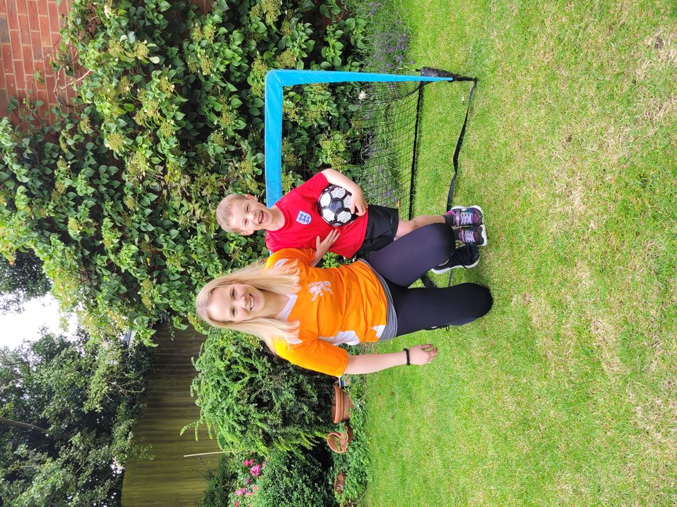 Woman and boy posing together