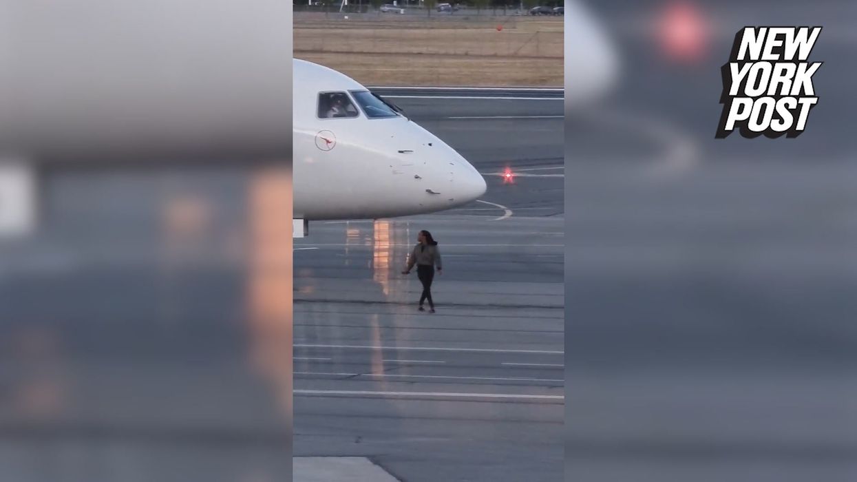 Woman squats in the middle of plane after being told she can't use bathroom