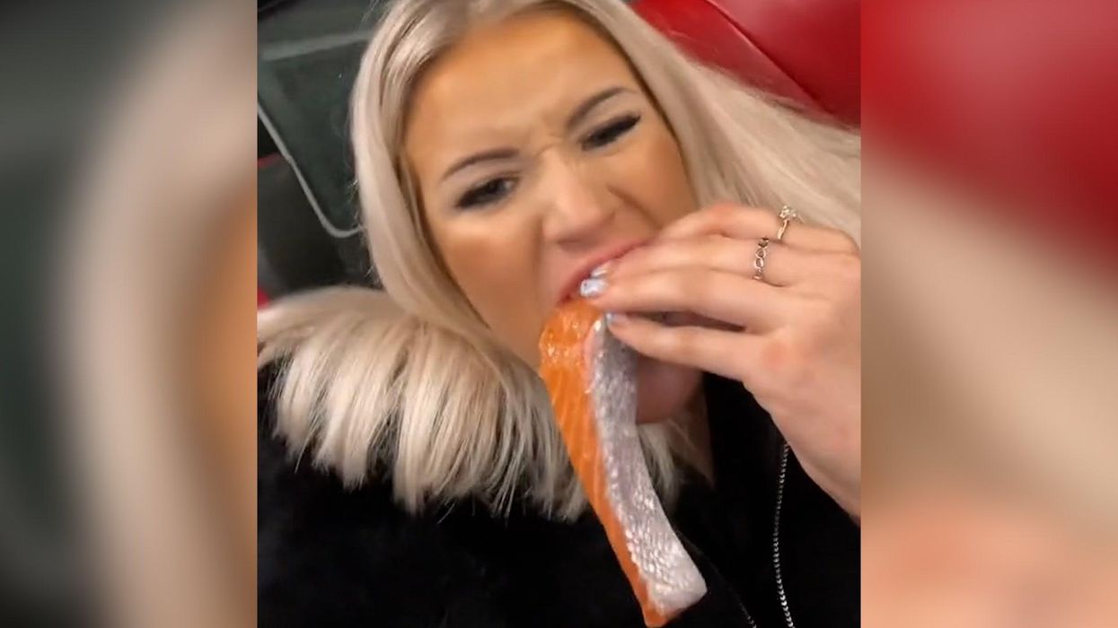 Woman eats raw salmon fillet on the bus and people are disgusted