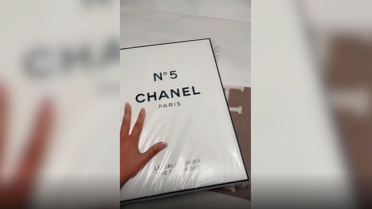 Russian models slice up Chanel bags in protest at sales ban