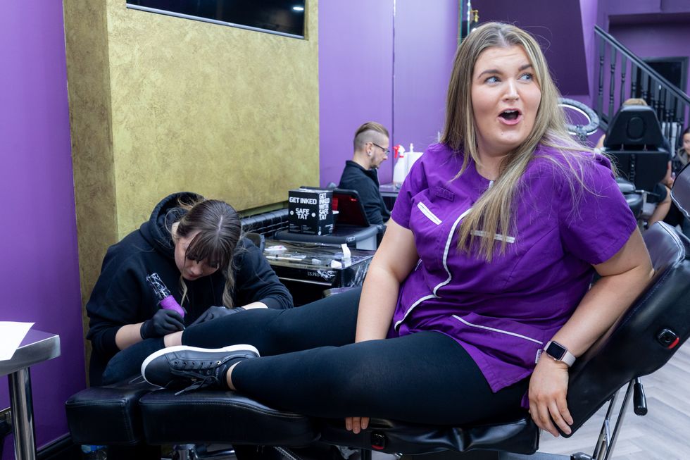 Woman gets tattoo on her ankle