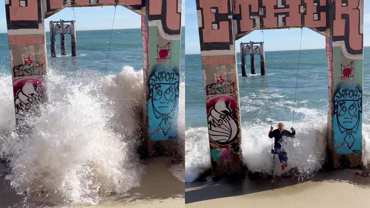 Woman gets wiped out by huge wave as she tries to take photo