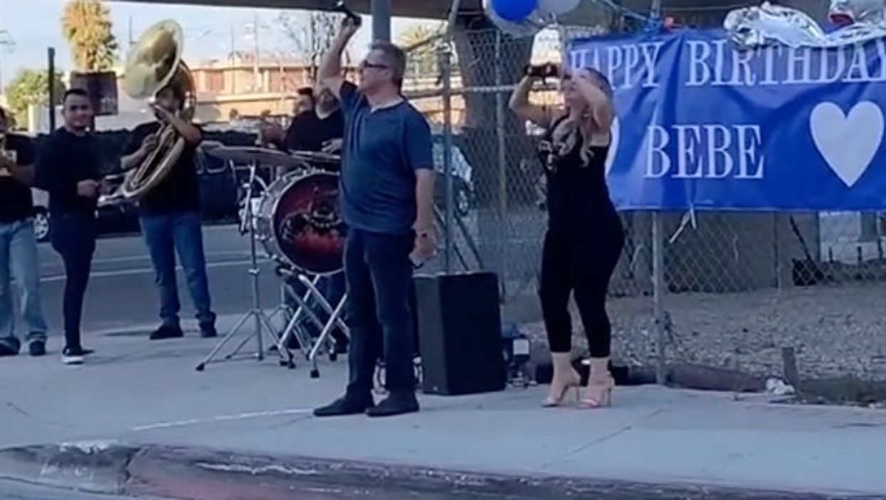 <p>Woman hires a band to play music outside of a prison for her fiancé </p>