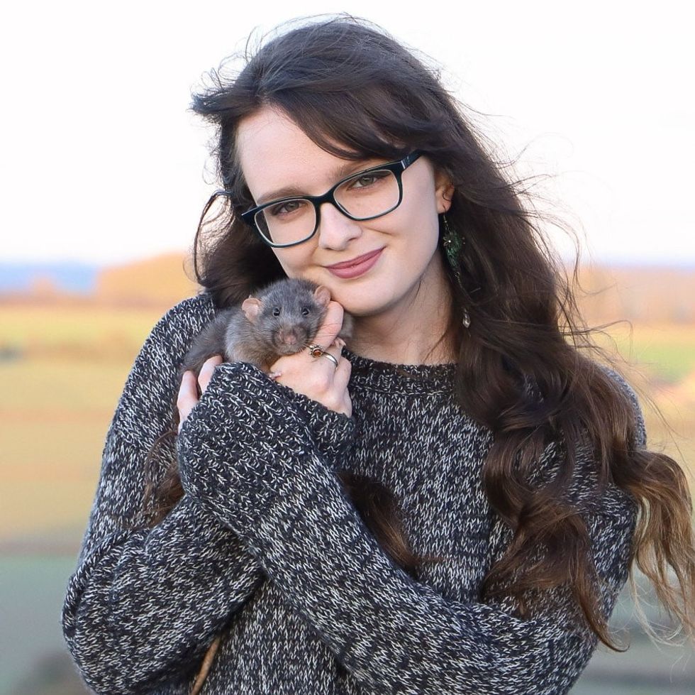 Woman holding rat