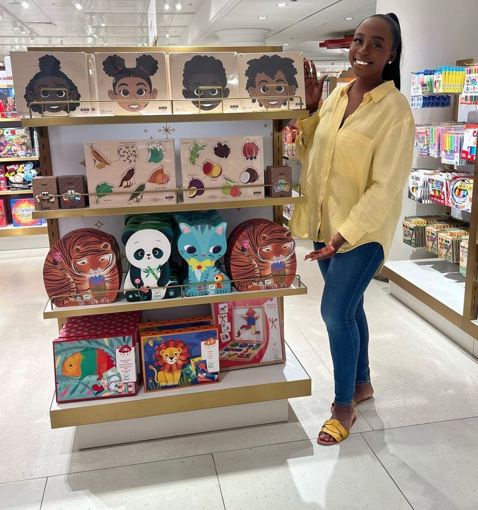 Woman posing near products