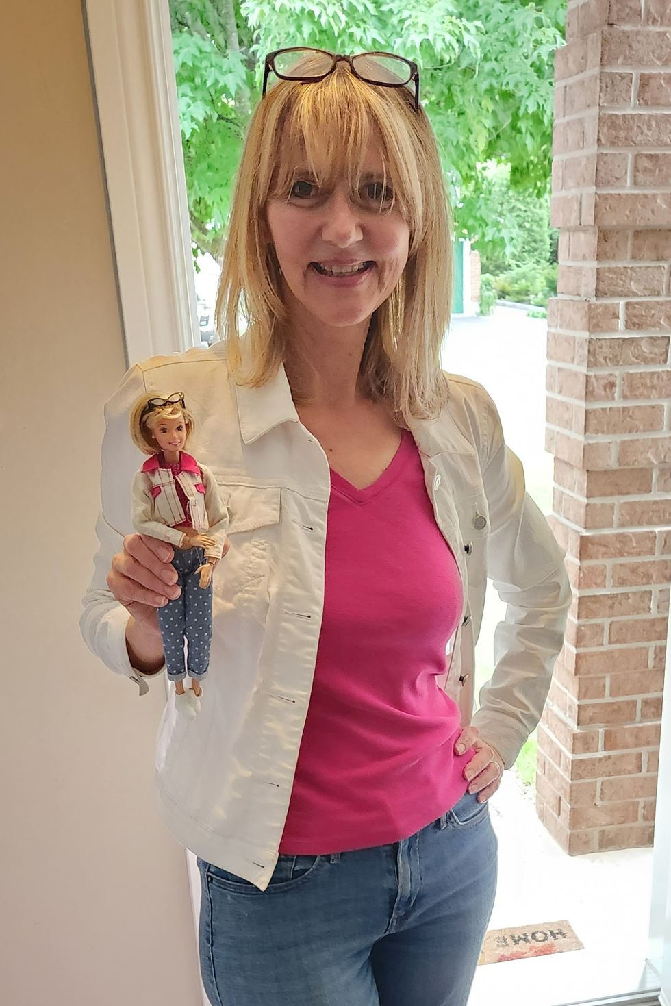 Woman posing with doll