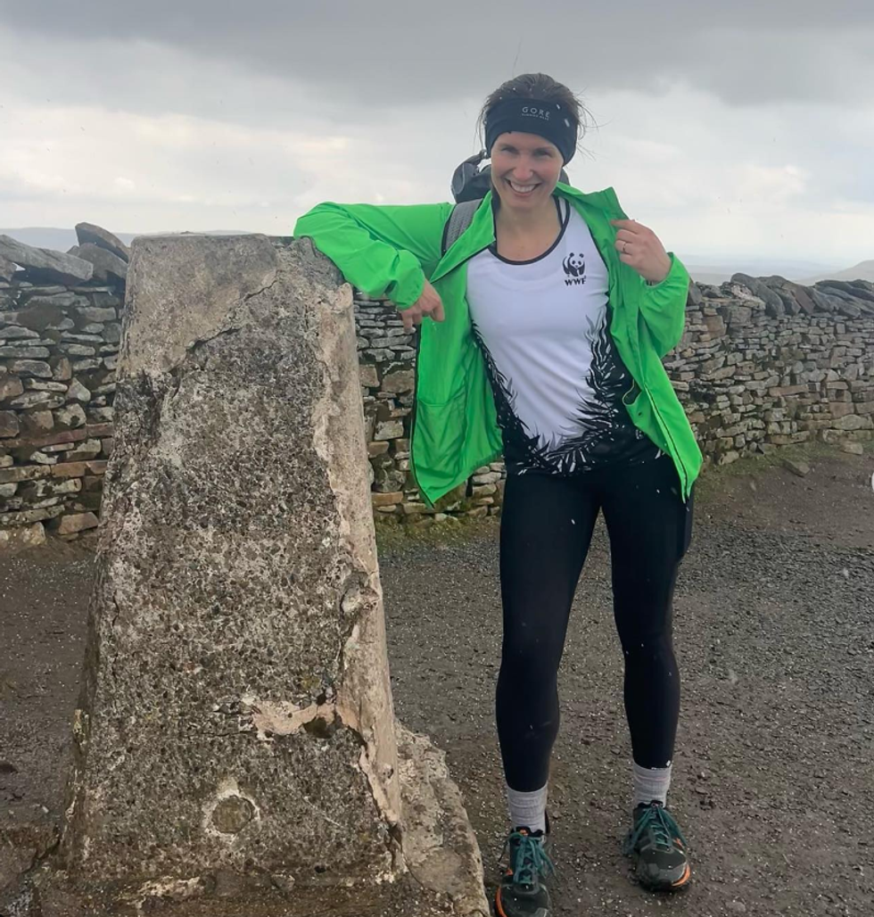 Woman posing with green jacket