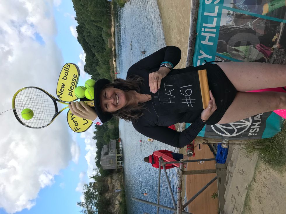 Woman posing with hat on her head