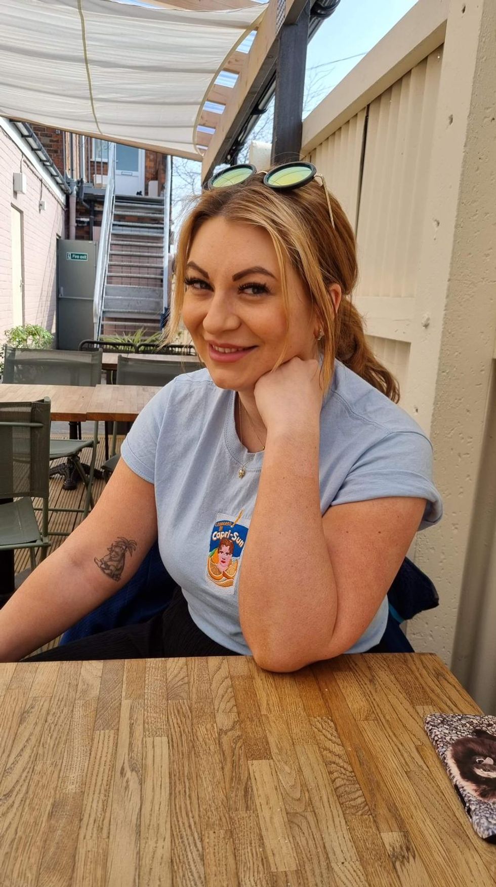 Woman resting her chin on her fist