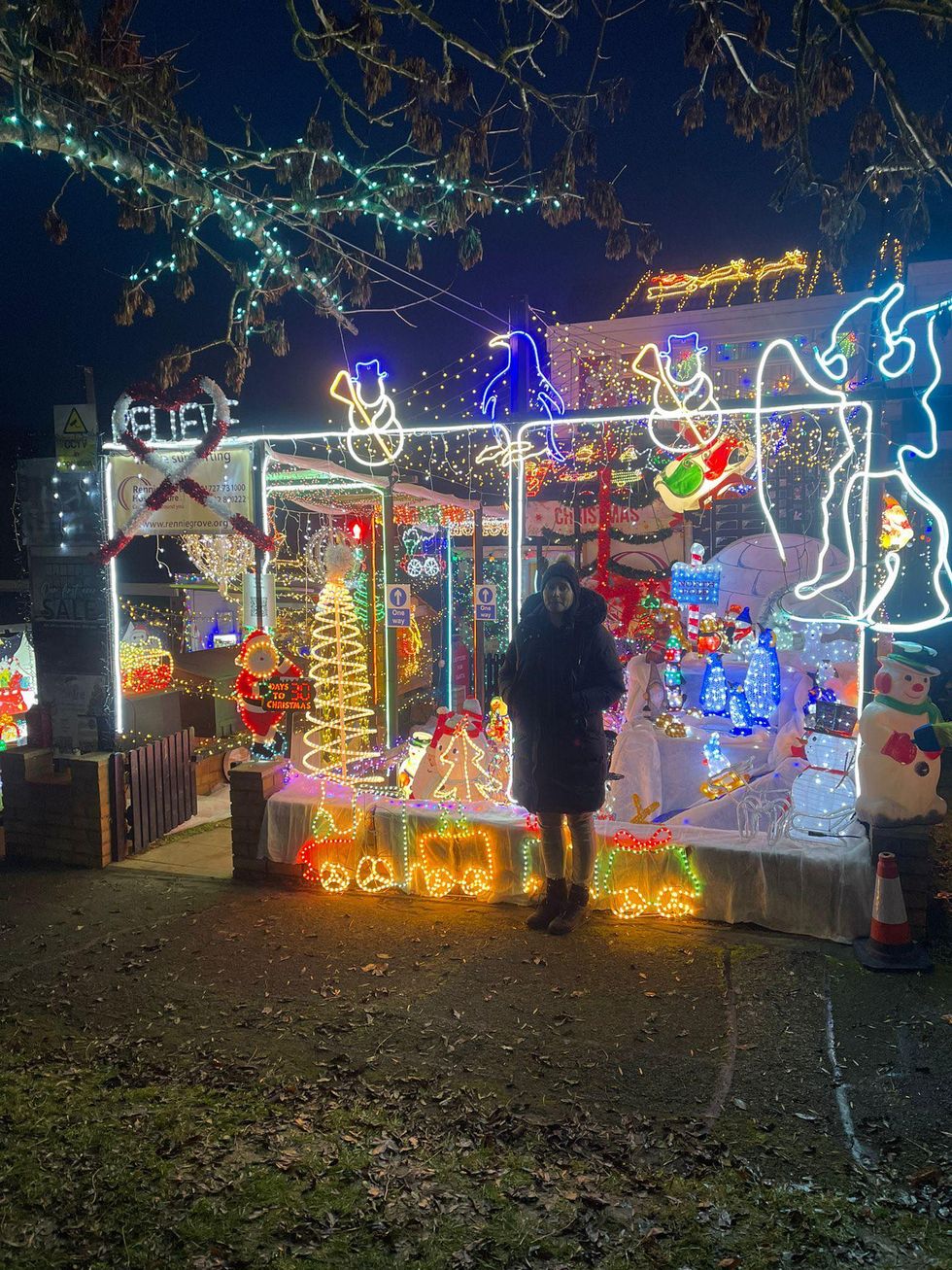 Woman standing in front of home