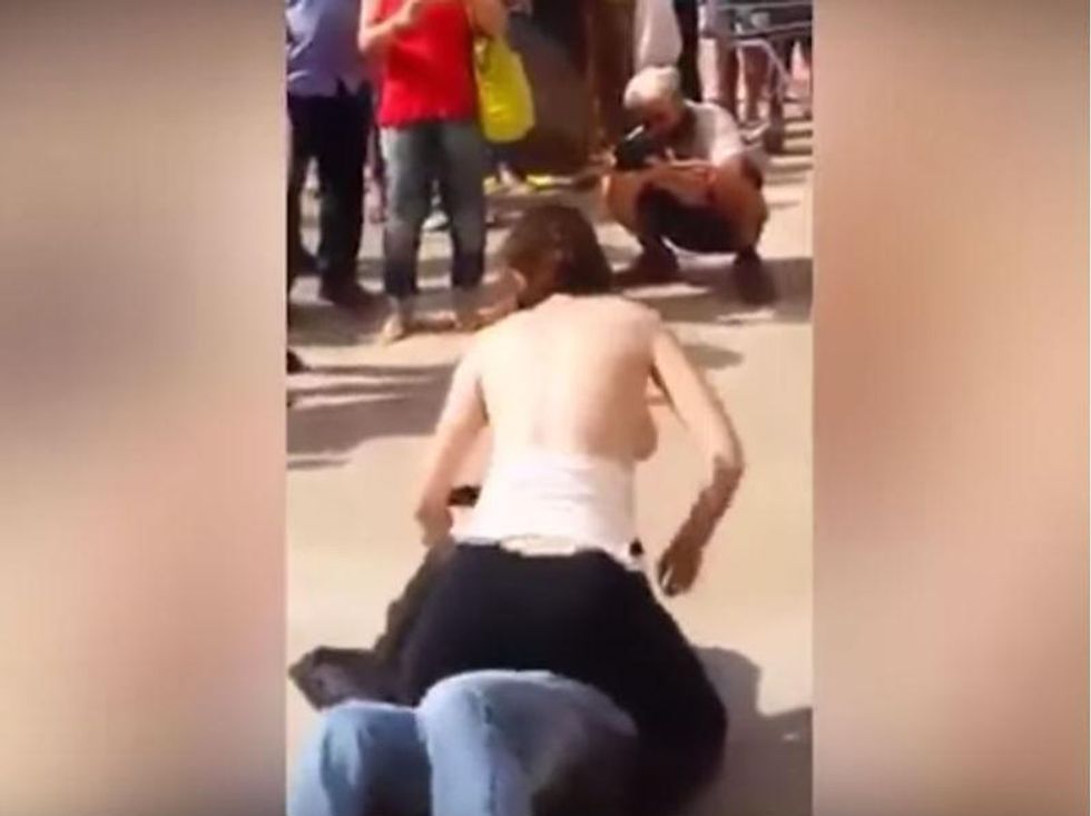 Woman in Brazil publicly rubs her bare breasts on a man's face in bizarre  anti-sexual harassment display, indy100