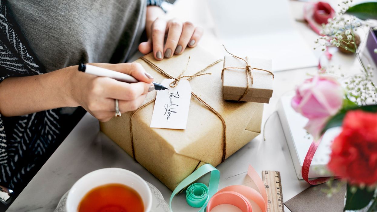 <p>Woman Writing Card for Gift </p>