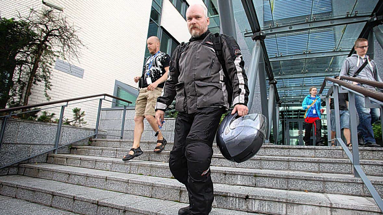 Workers leave software company Microsoft's office, in Oulu, Finland