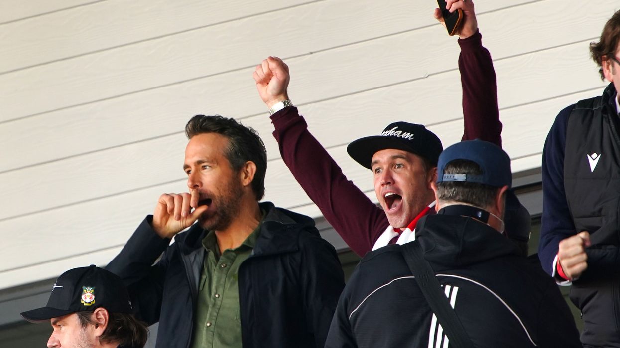 Wrexham owners Ryan Reynolds (left) and Rob McElhenney (centre) celebrate their side’s first goal (PA Wire)