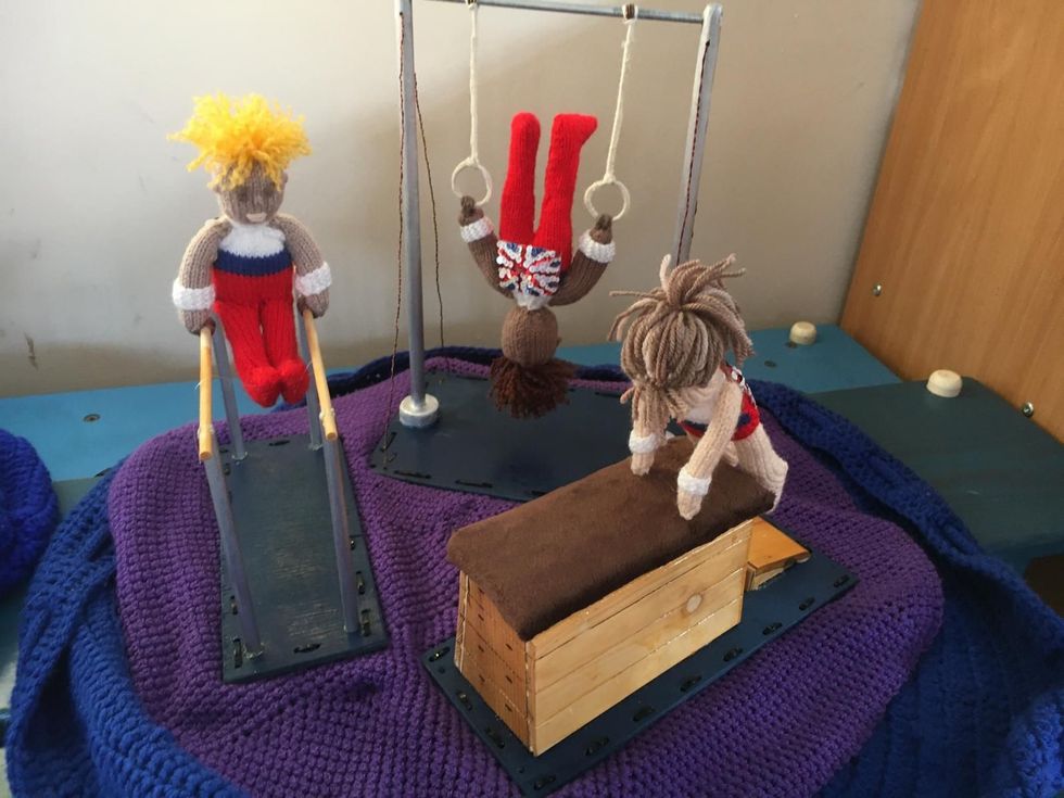 Yarn figures doing acrobatic moves