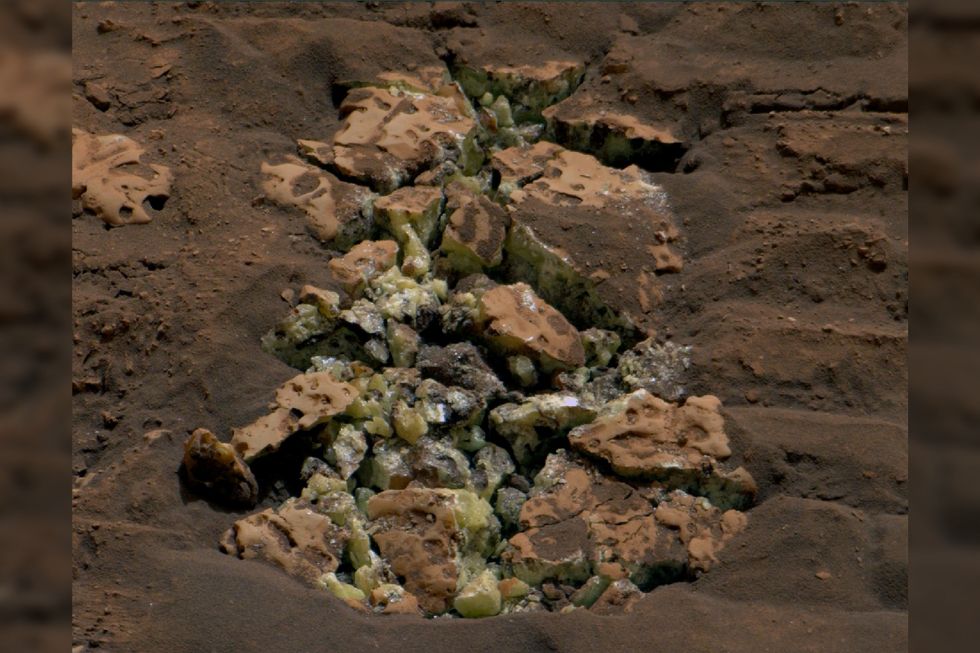 Yellow sulphur crystals unearthed after NASA\u2019s Curiosity rover drove over a rock and cracked it open on May 30