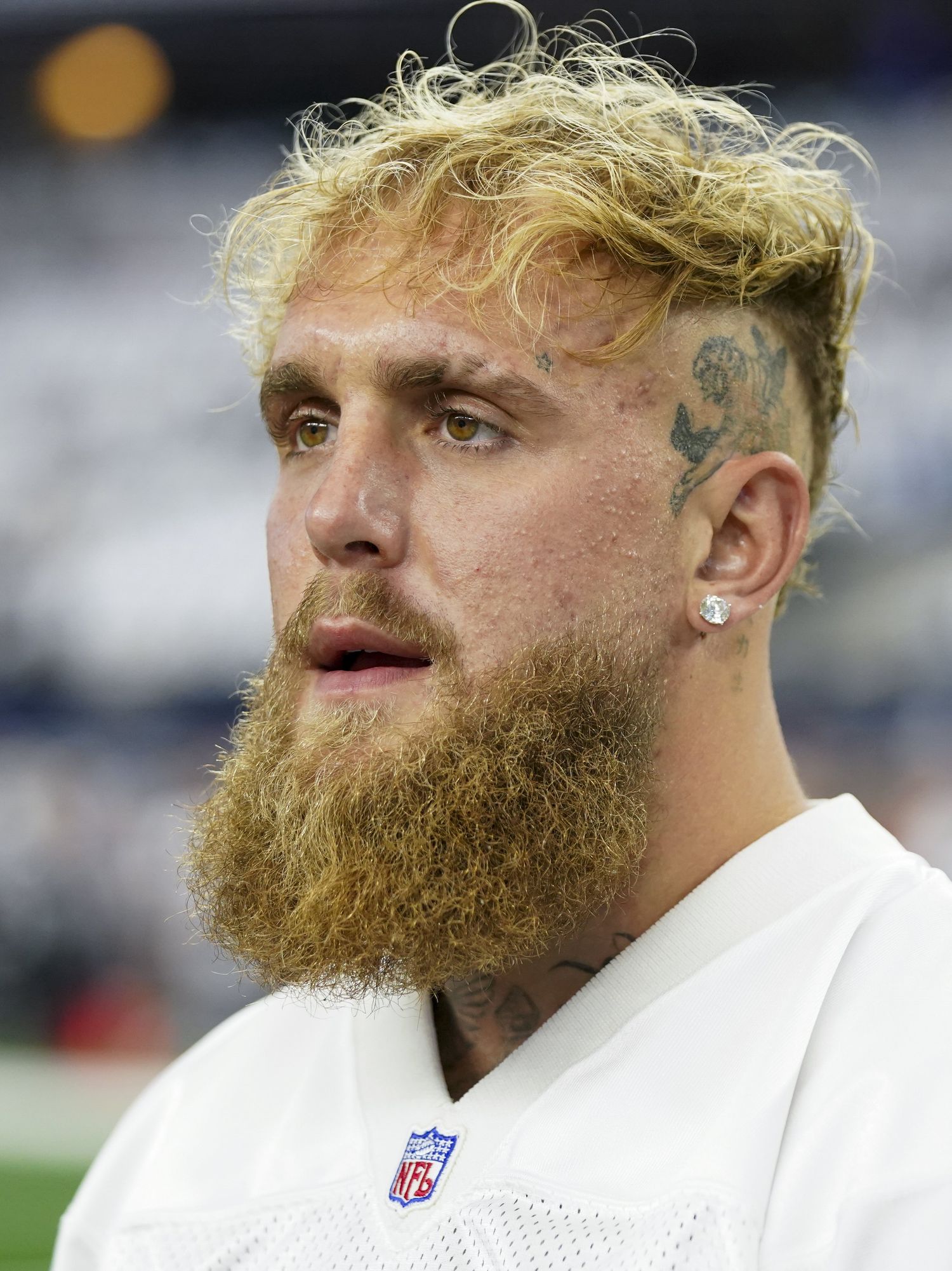 YouTuber and boxer Jake Paul looks on prior to an NFL football game between the Dallas Cowboys and the New Orleans Saints, Sunday, Sept. 15, 2024, in Arlington, Texas