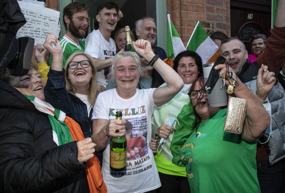 Yvonne Harrington (centre) celebrates with family and friends outside her home in Dublin (Damian Eagers/PA)