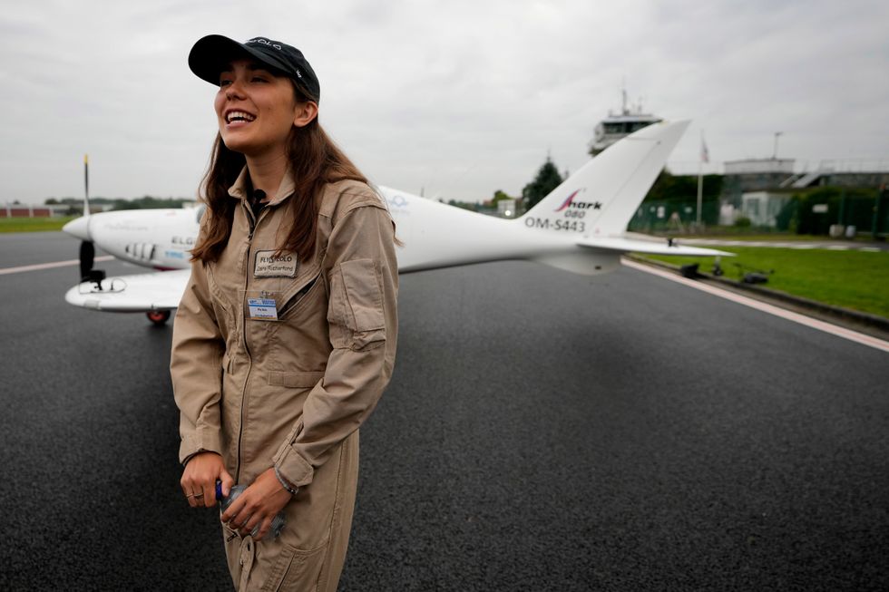 Zara Rutherford in front of her Shark Ultralight plane prior to take-off at the Kortrijk-Wevelgem airfield in Wevelgem, Belgium (Virginia Mayo/AP)