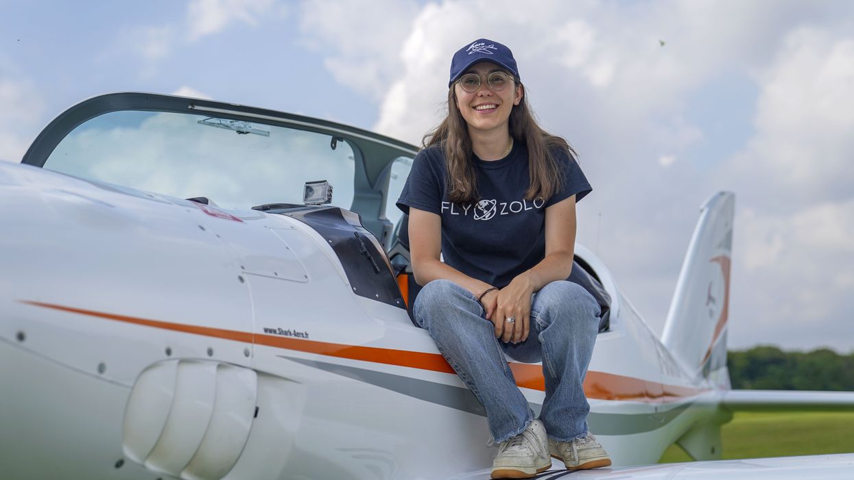 Zara Rutherford with a Shark Ultralight plane at Popham Airfield in Winchester, Hampshire (Steve Parsons/PA)